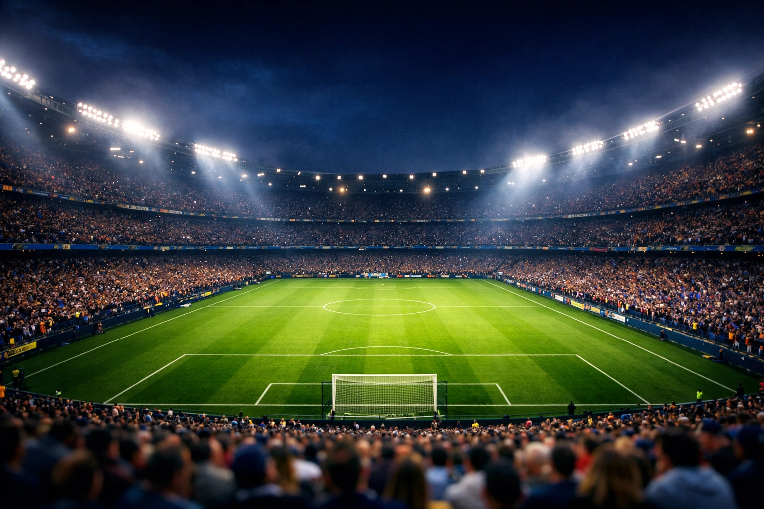 Beleuchtetes Fußballstadion bei Nacht für Sportwetten Prognosen zum La Liga Kracher.