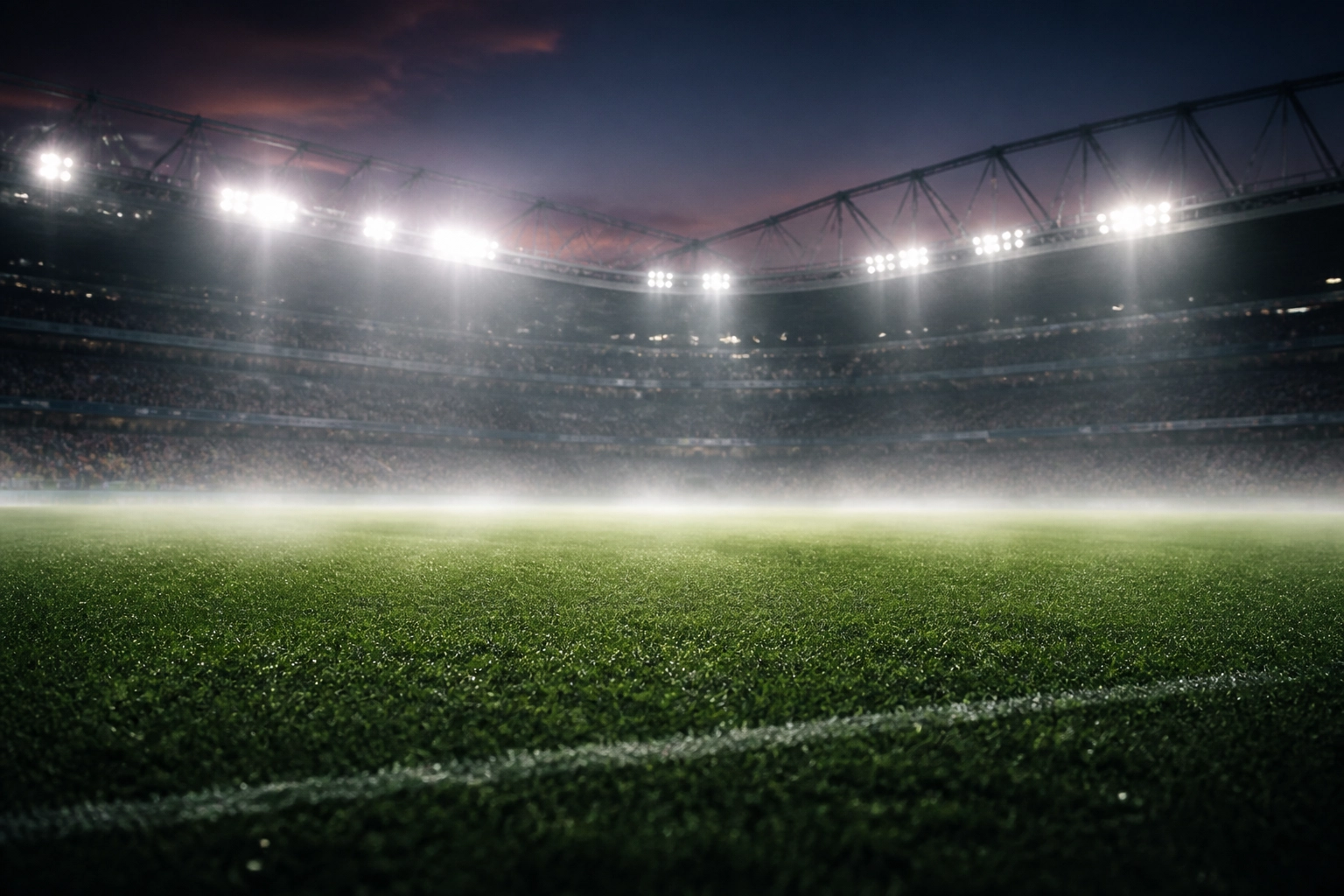 Atmosphärisches englisches Fußballstadion im Flutlicht für die Premier League Analyse am Wochenende.