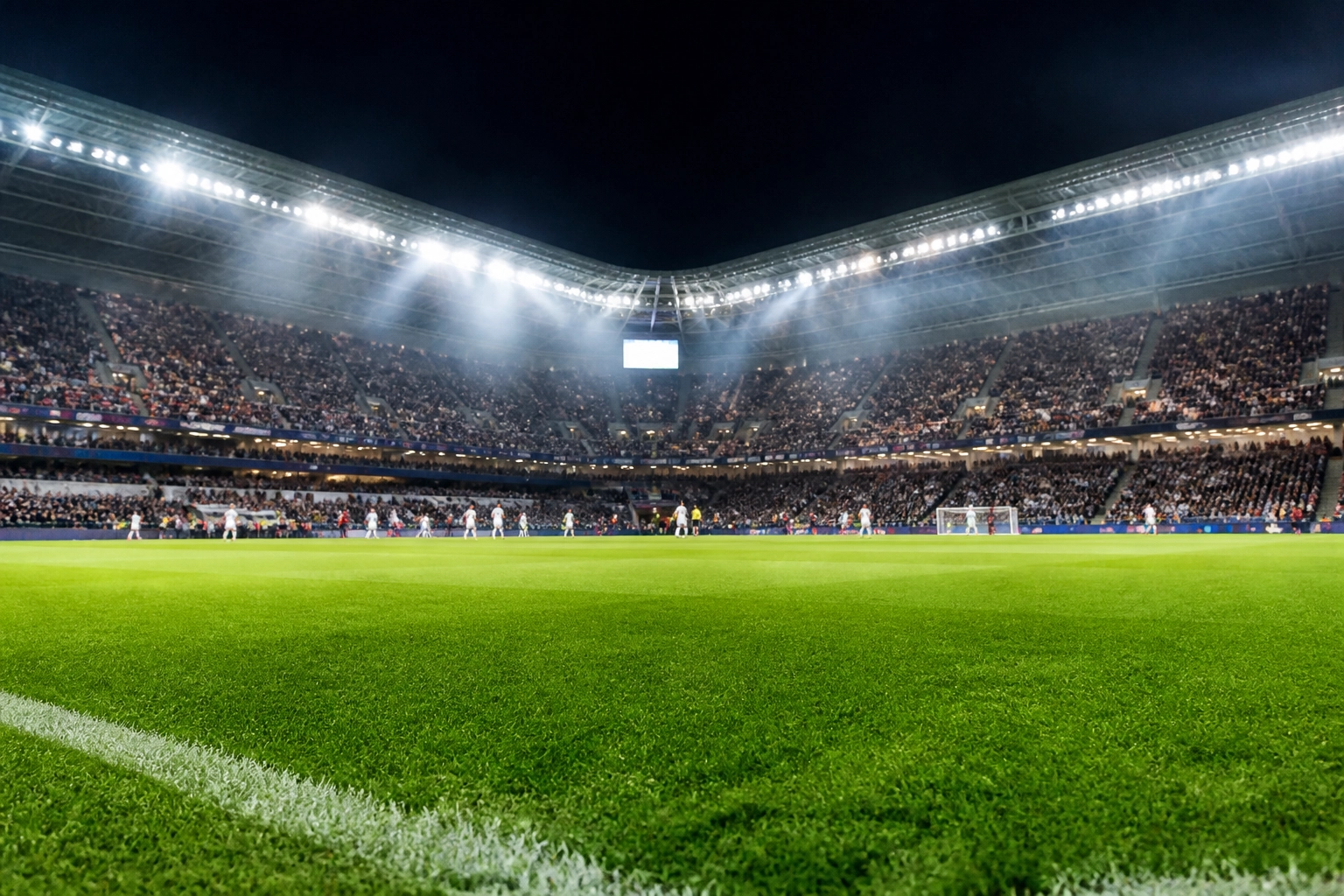 Modernes Fußballstadion bei Flutlicht für die Bundesliga-Analyse der Top-Ligen.