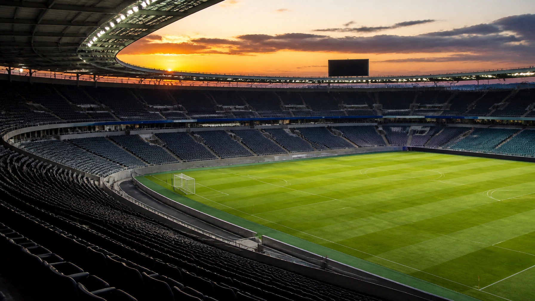 Stimmungsbild eines modernen Fußballstadions bei Sonnenuntergang