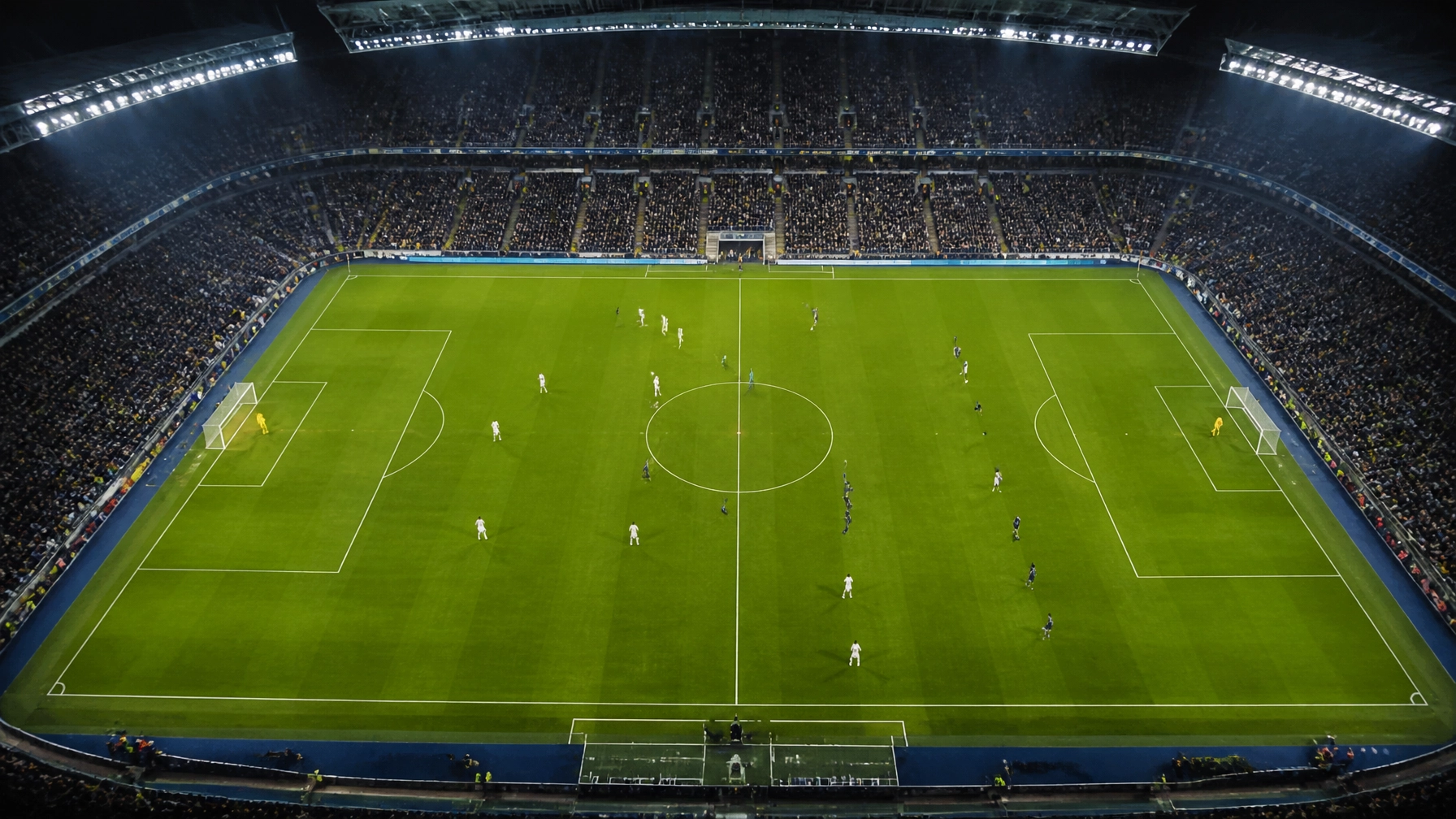 Vogelperspektive auf ein modernes Fußballstadion während eines Abendspiels
