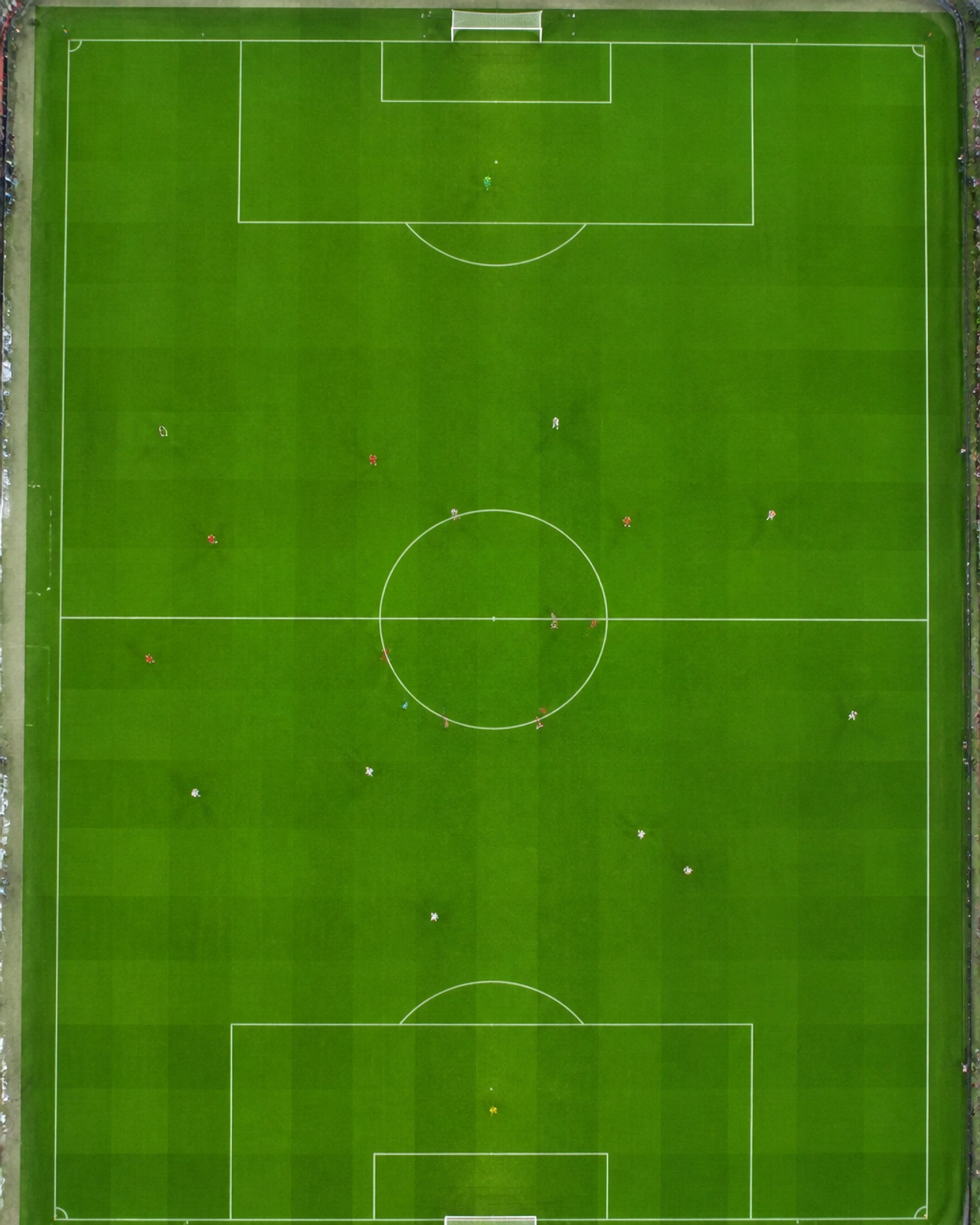 Grafische Darstellung eines Fußballfeldes aus der Vogelperspektive