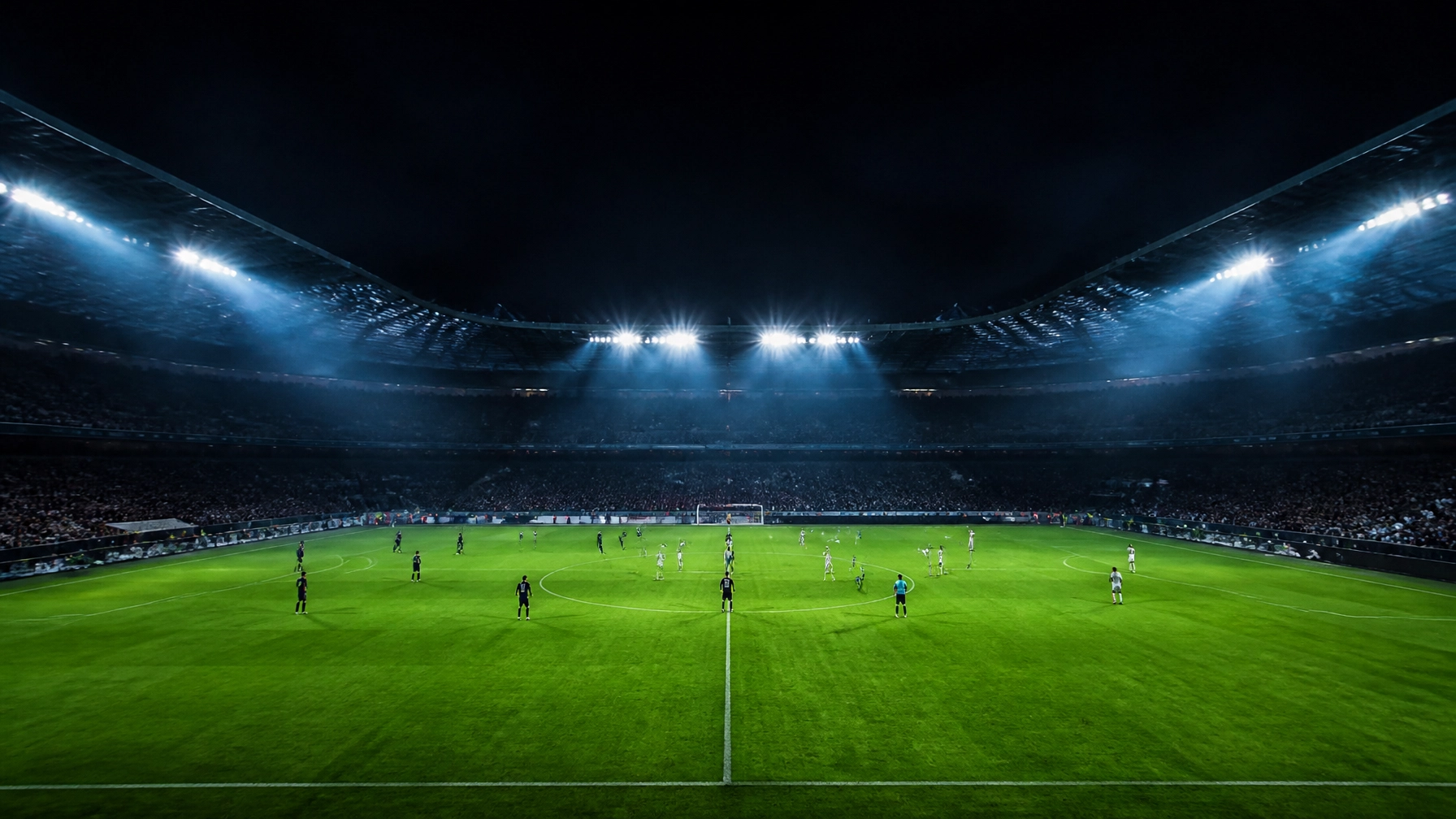Zwei neutrale Mannschaften als entfernte Silhouetten beim Anstoß auf einem Stadionrasen