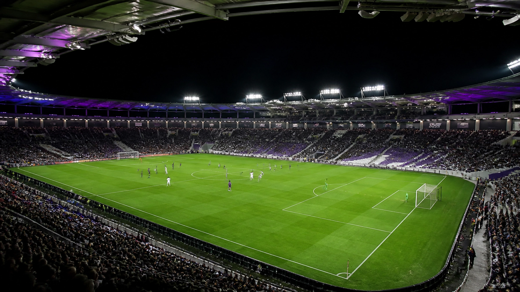 Nächtliche französische Fußballstadionatmosphäre als neutrale Matchszene
