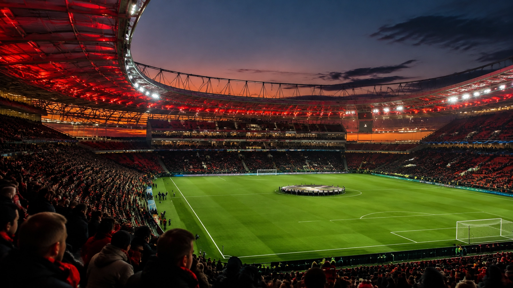 Beleuchtete deutsche Fußballarena bei Dämmerung vor dem Europa-League-Auftakt