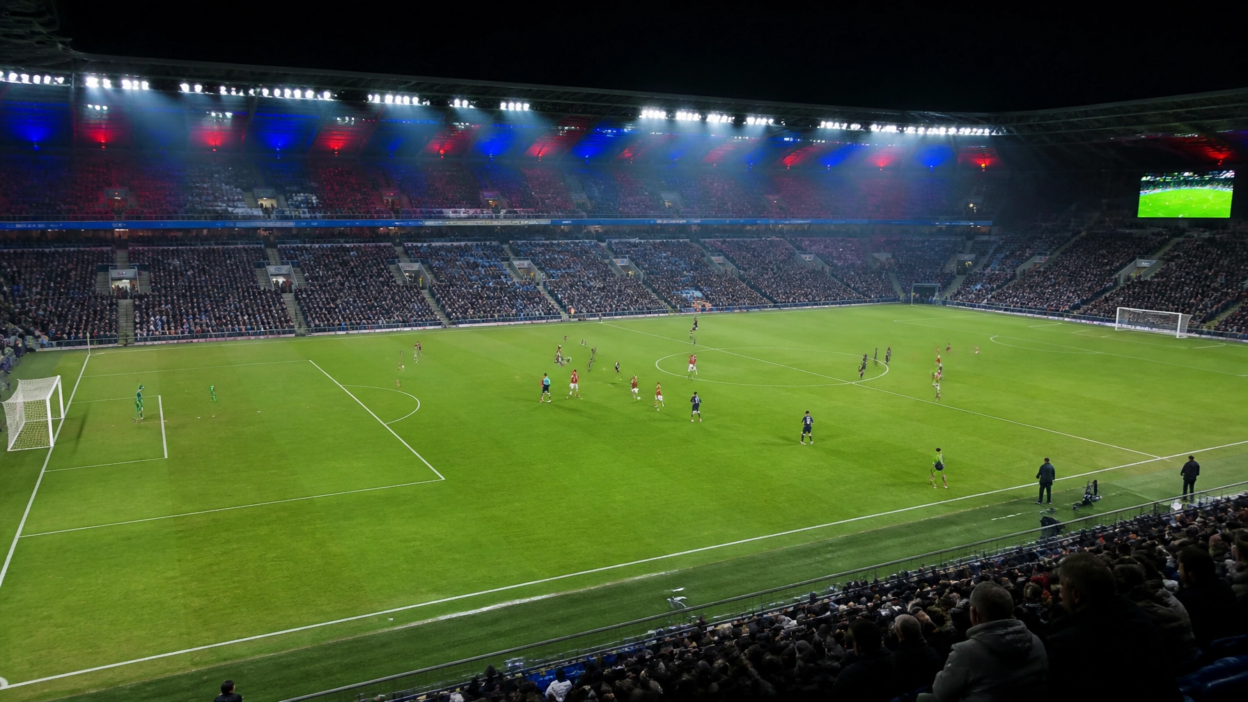 Skandinavische Fußballstadionatmosphäre bei Nacht mit offenem Spielverlauf